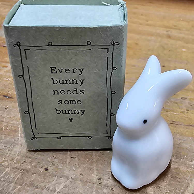 CERAMIC FIGURE IN A MATCHBOX B