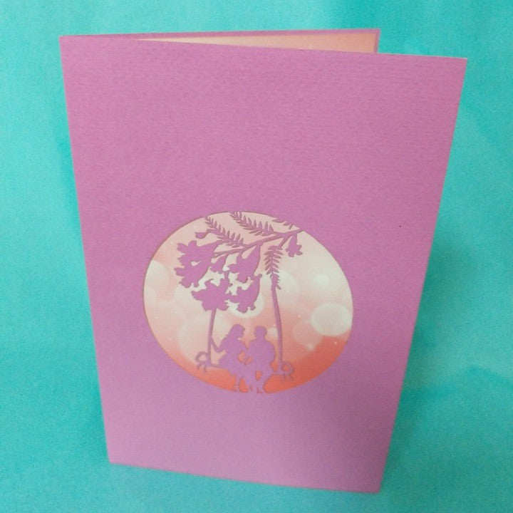 POP UP CARD LOVERS SWINGING IN JACARANDA
