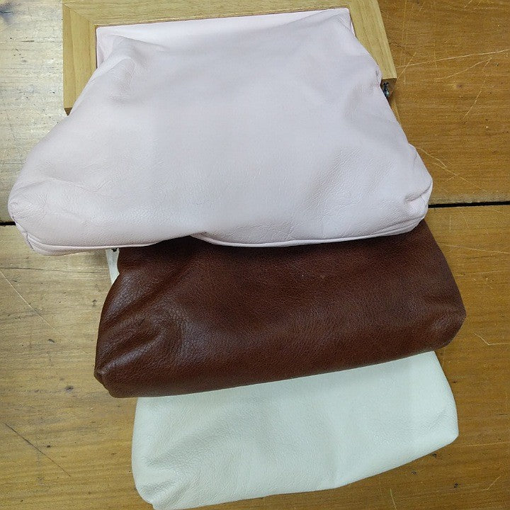 YELLOWBIRD LEATHER CLUTCH BAG