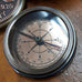 BRASS COMPASS WITH 1930 PENNY LID IN LEATHER BOX