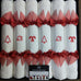6 FESTIVE CHRISTMAS CRACKERS IN WHITE LINEN NAPKINS