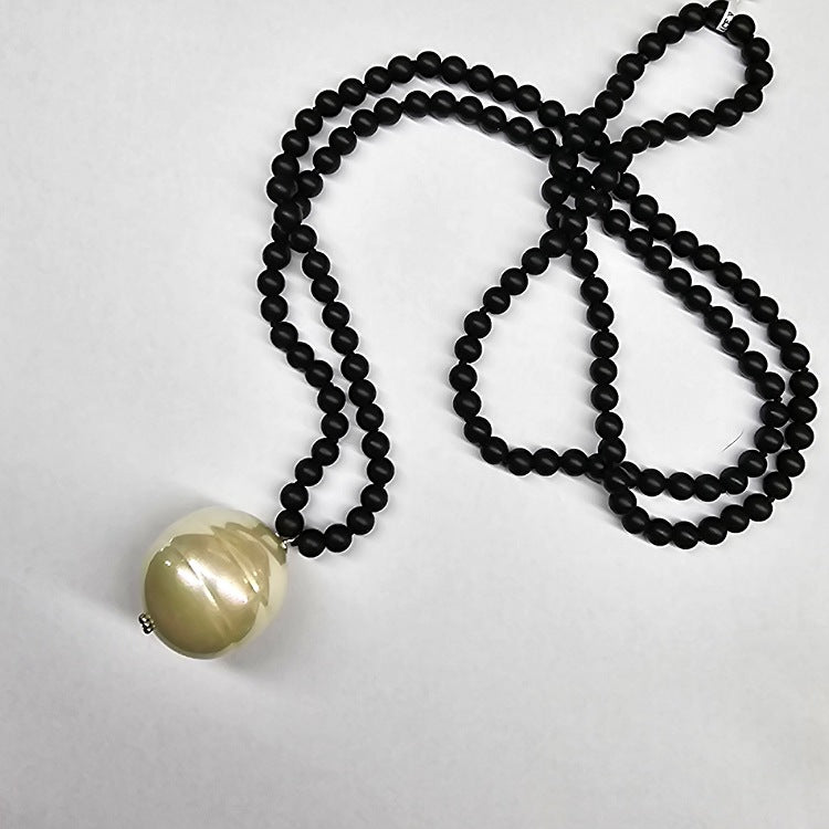 UNPOLISHED ONYX NECKLACE WITH 3CM SPANISH PEARL