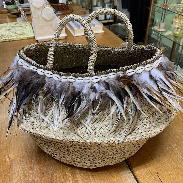 WOVEN BASKET EDGED WITH FEATHERS