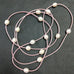 LONG LEATHER STRAND WITH PEARLS NECKLACE